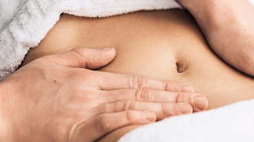 Professional massage of the abdomen.