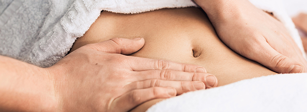 Professional massage of the abdomen.